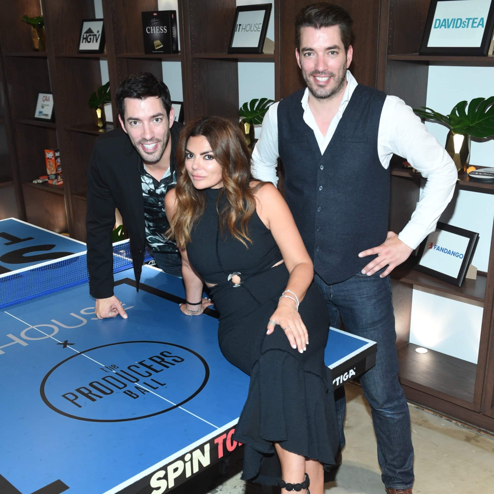 Natasha and the Property Brothers at NKPR It-House sitting on a ping pong table.