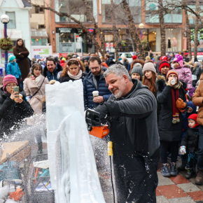 Sculptor carves an ice sculpture at the Bloor-Yorkville ice festival.